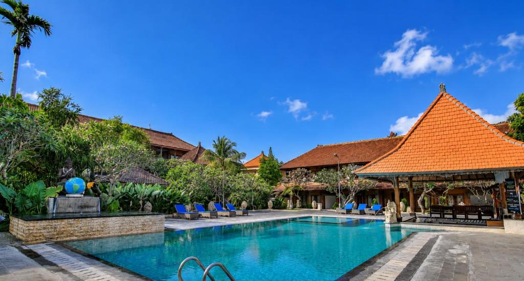 an image of a swimming pool at a resort at Satriya Cottages in Kuta