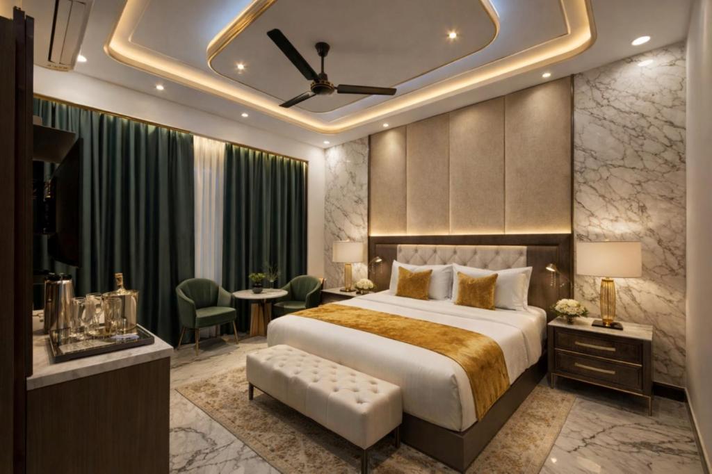a hotel room with a bed and a table and chairs at Royal Awadh Inn Near Shree Ram mandir in Ayodhya