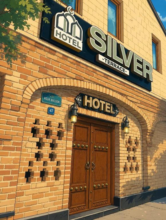 a sign above the door of a hotel at SILVER Inn in Bukhara