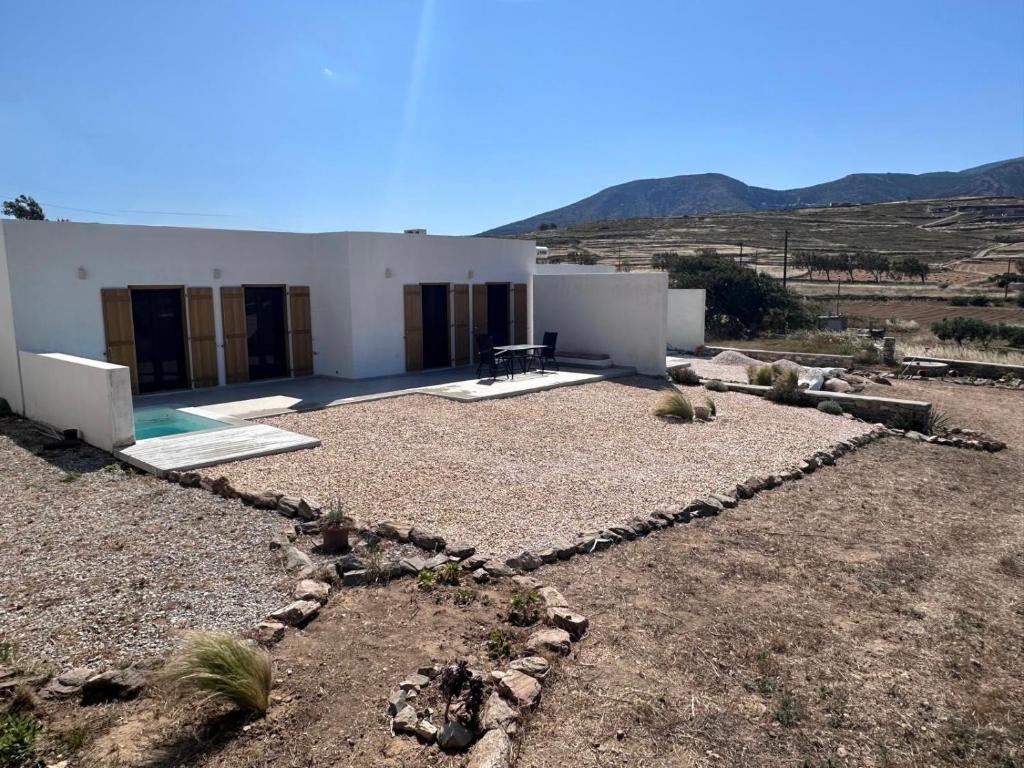 a house in the middle of a field at Elysian Sea View New Golden Beach Piso Livadi in Chrissi Akti