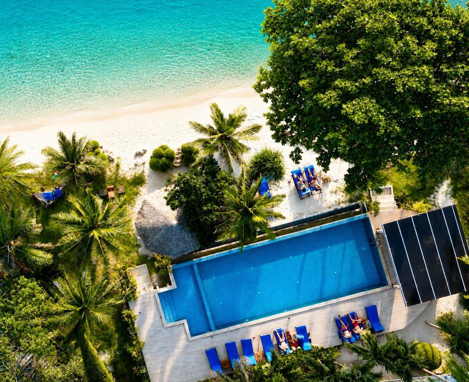 an overhead view of a swimming pool next to the beach at Sunset Beach Villas in Haad Rin