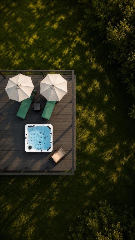 an overhead view of a picnic table with umbrellas at Rezydencja Bieszczady - Solina in Solina