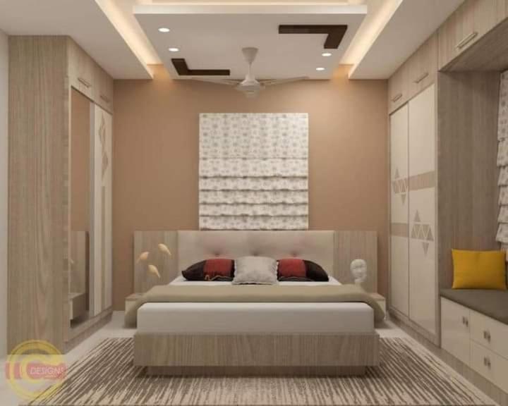 a bedroom with a large bed in a room at Home in Faisalabad