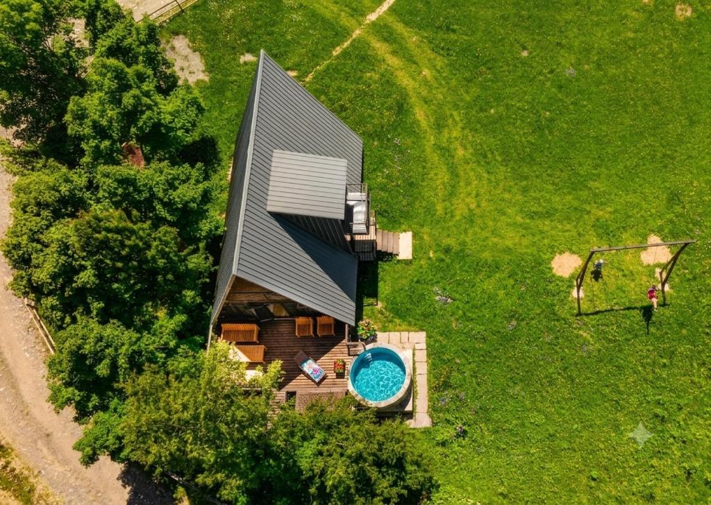 an overhead view of a house with a swimming pool at Hatsvali Gate in Mestia