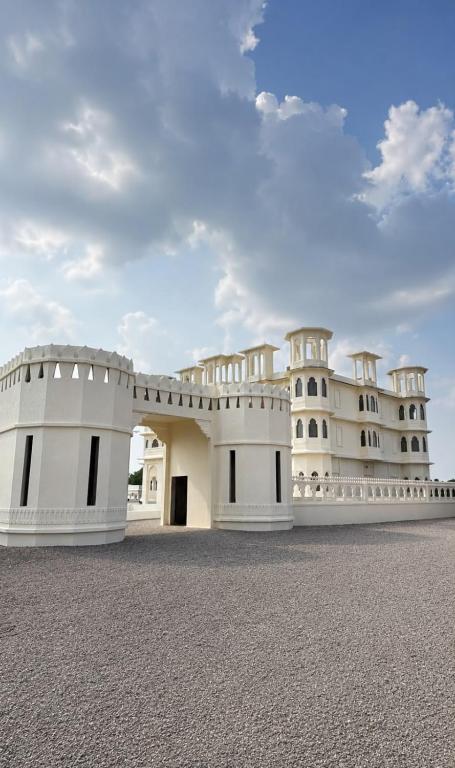 a white building with a sky in the background at Marudhar Resort in Chittaurgarh