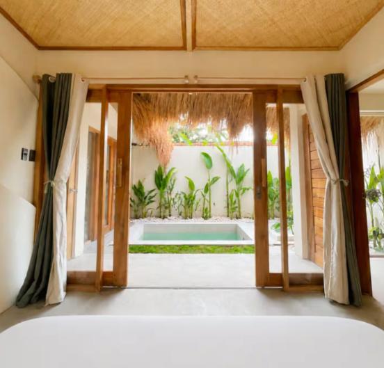 a room with a door open to a yard at Villa Xana - Private pool - SOFT OPENING in General Luna