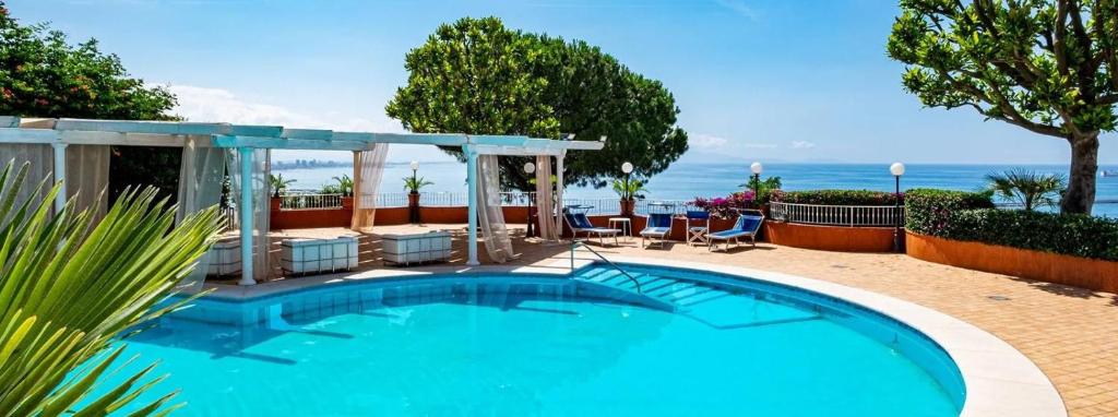 a swimming pool with a view of the ocean at Villa Poseidon -Boutique Hotel- in Salerno