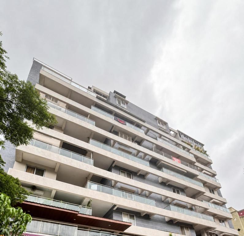 an apartment building with balconies on the side of it at Nestoria Corporate Services in Pune