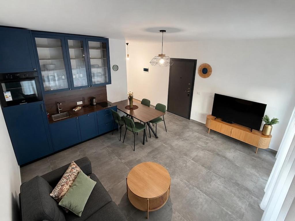 a living room with a couch and a table at BR Tale in Lezhë