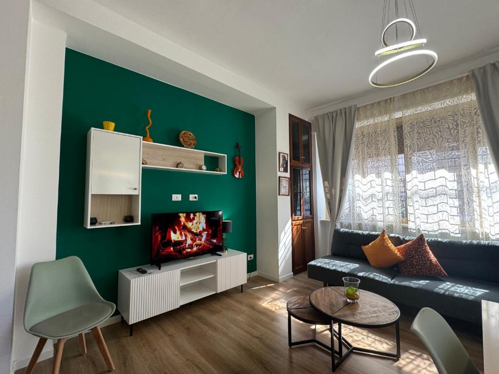 a living room with a couch and a fireplace at Rome - Green Hills condominio in Colleverde