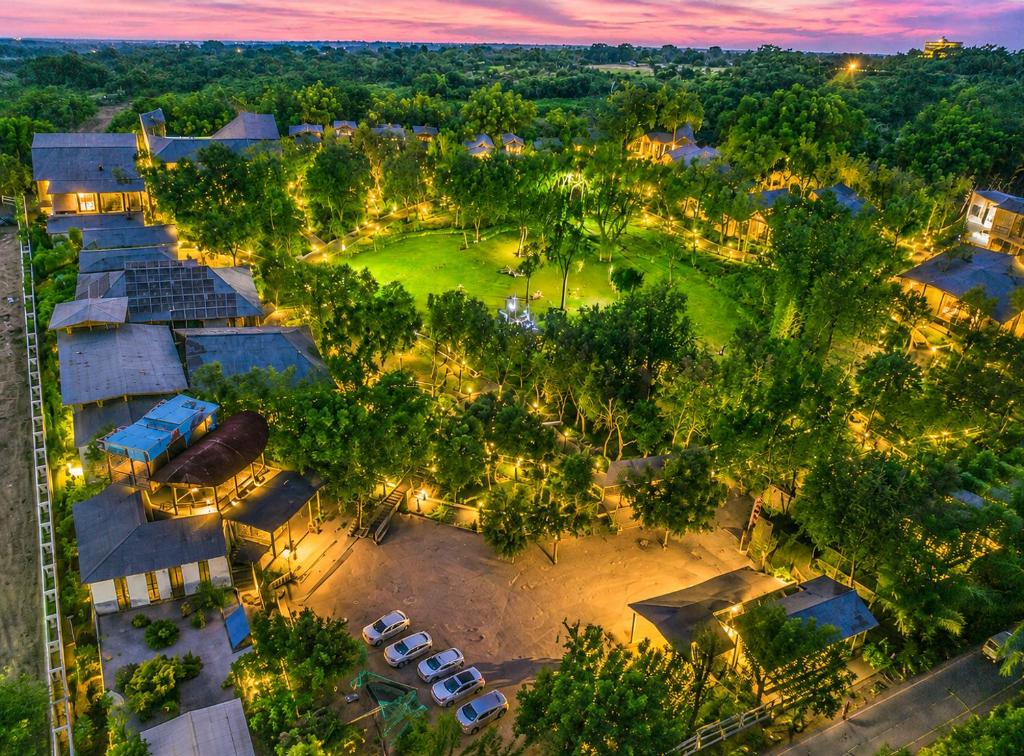 an overhead view of a park at night with lights at Sterling Padam Pench in Khawāsa