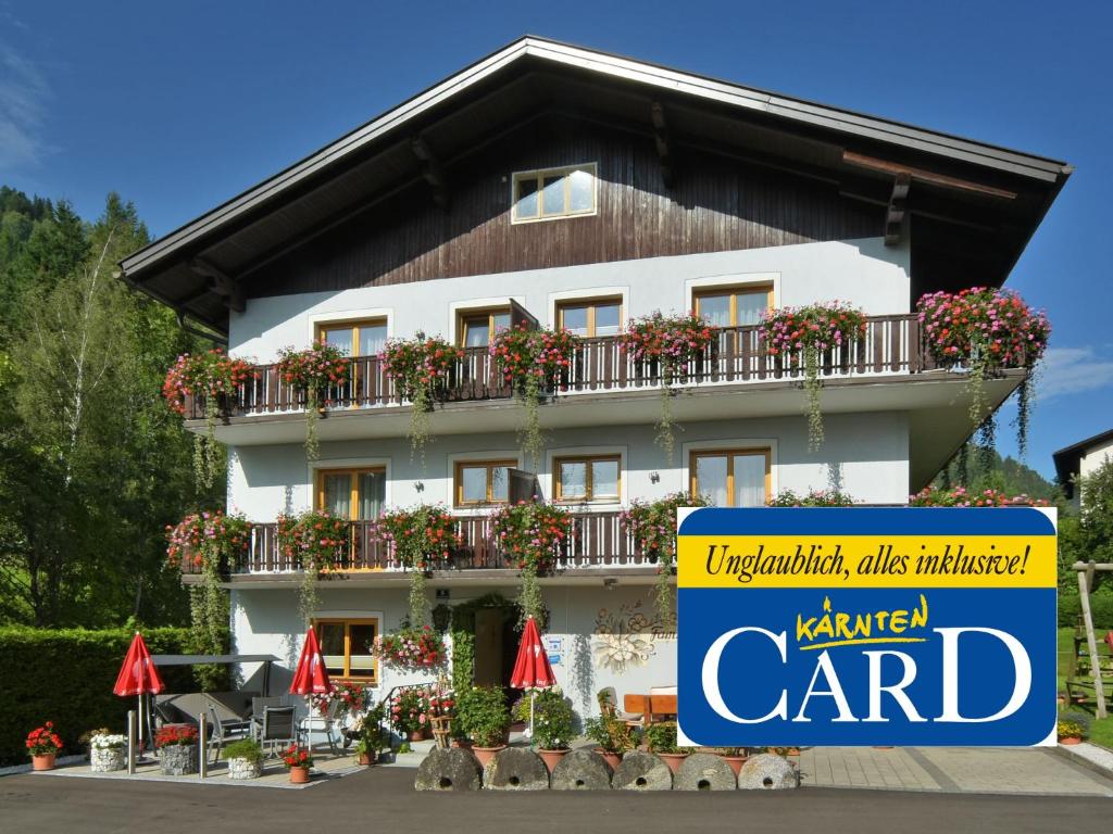 a building with a sign in front of it at Pension Isabella in Bad Kleinkirchheim