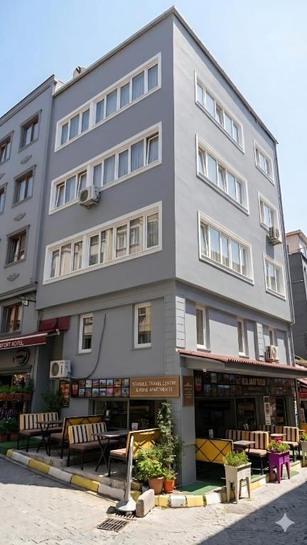 a large gray building with benches in front of it at Blue Amedist Hotel in Istanbul