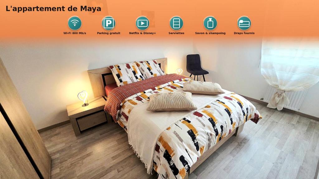 a bedroom with a bed with an orange and white comforter at L'appartement de Maya in Saint-Priest