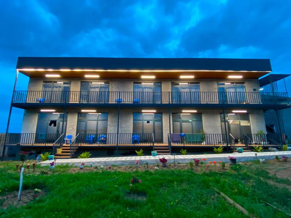a large building with a lot of windows at Elida Guest Rooms in Cholpon-Ata