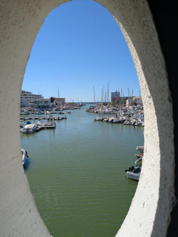 a view of a harbor with boats in the water at Carnon-plages - Agréable Studio cabine in Mauguio