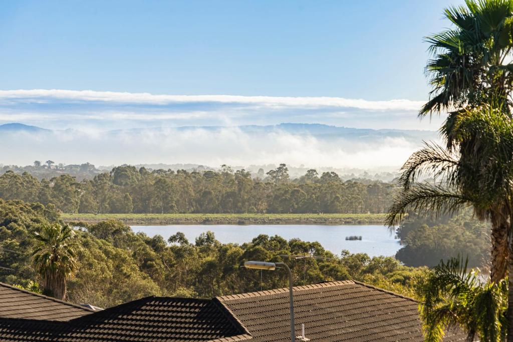 a view of a lake from a house at The Lakeview in Lilydale