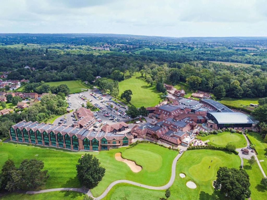 an aerial view of a building with a golf course at Old Thorns Golf Resort And Spa Hampshire by Accor in Liphook