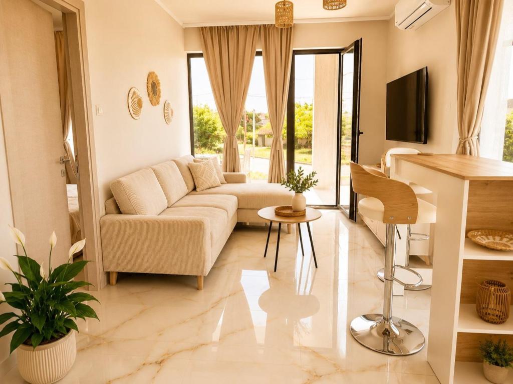 a living room with a couch and a table at Amore Fanari in Fanari