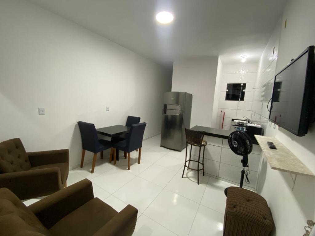 a living room with a couch and a table at Apartamento no Crato, conforto e praticidade! in Crato