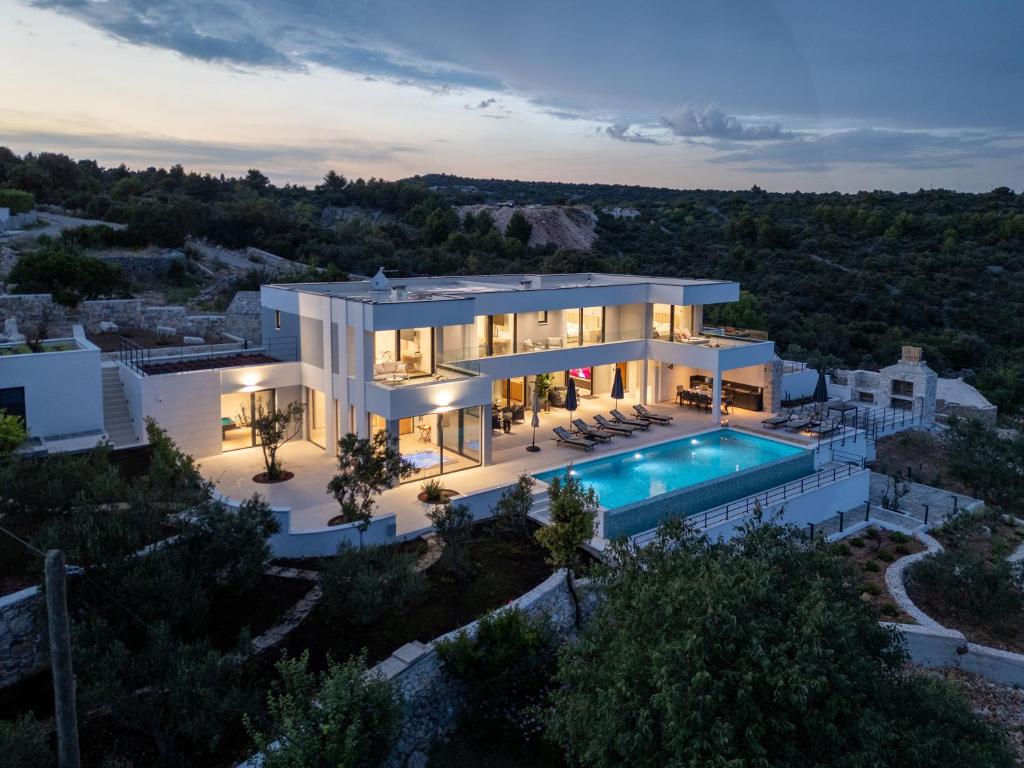 an aerial view of a house with a swimming pool at View Villas Collection in Vinišće