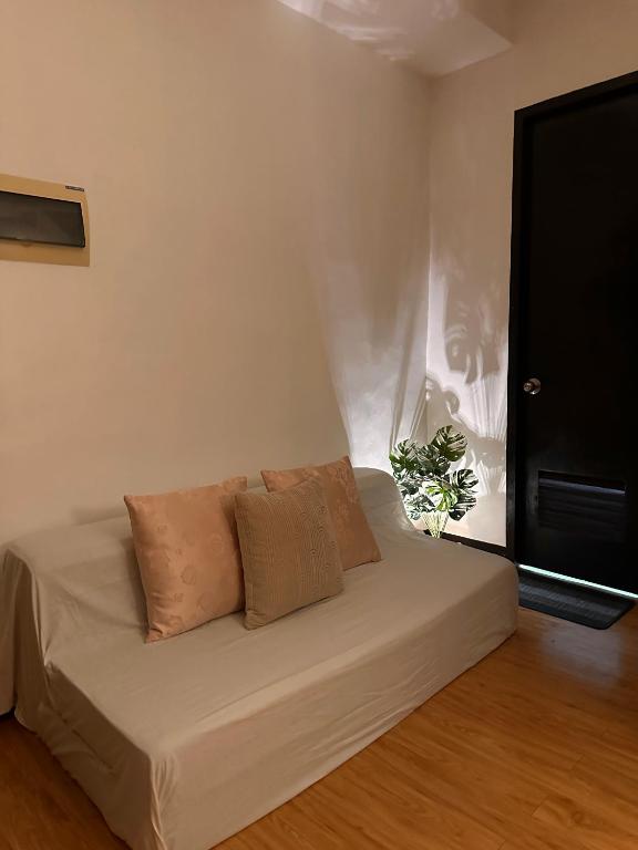 a bed with two pillows in a room at MK Suites CDO in Pontud