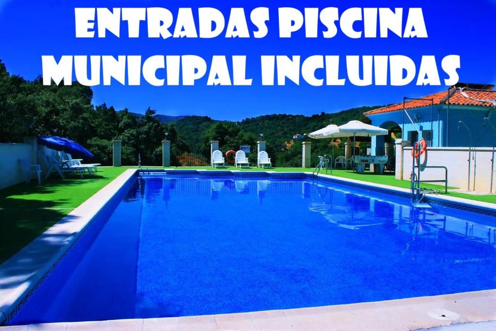 an image of a swimming pool with the words emirates psina municipal holidays at La Casa Del Bosque in Júzcar