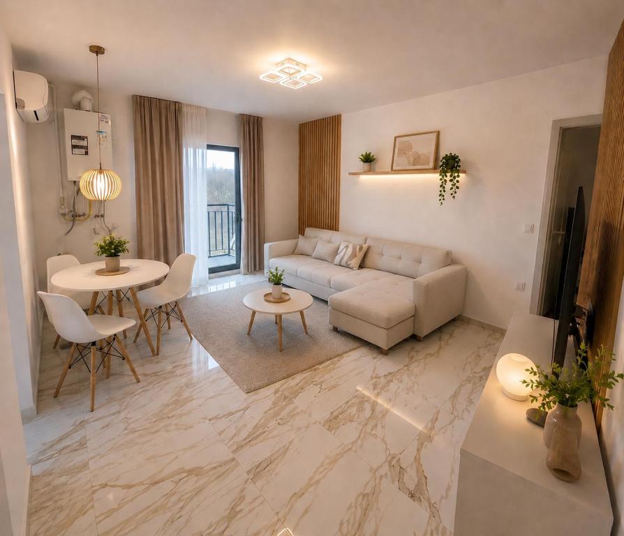 a living room with a couch and a table at LWS Apartments in Dej