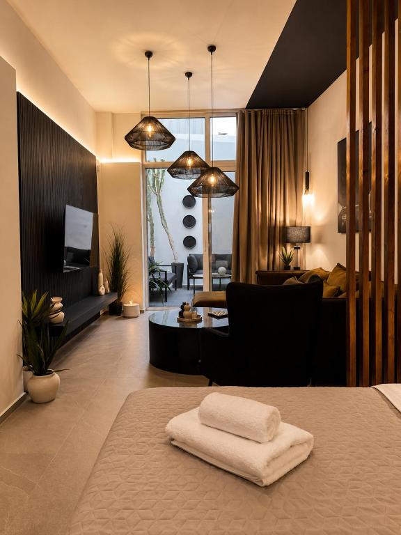 a living room with a bed and a living room at Cabana Condo in Ierapetra