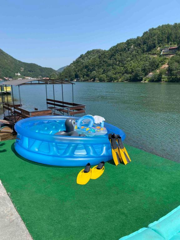 a blue inflatable raft on top of a body of water at Drinska oaza in Zvornik