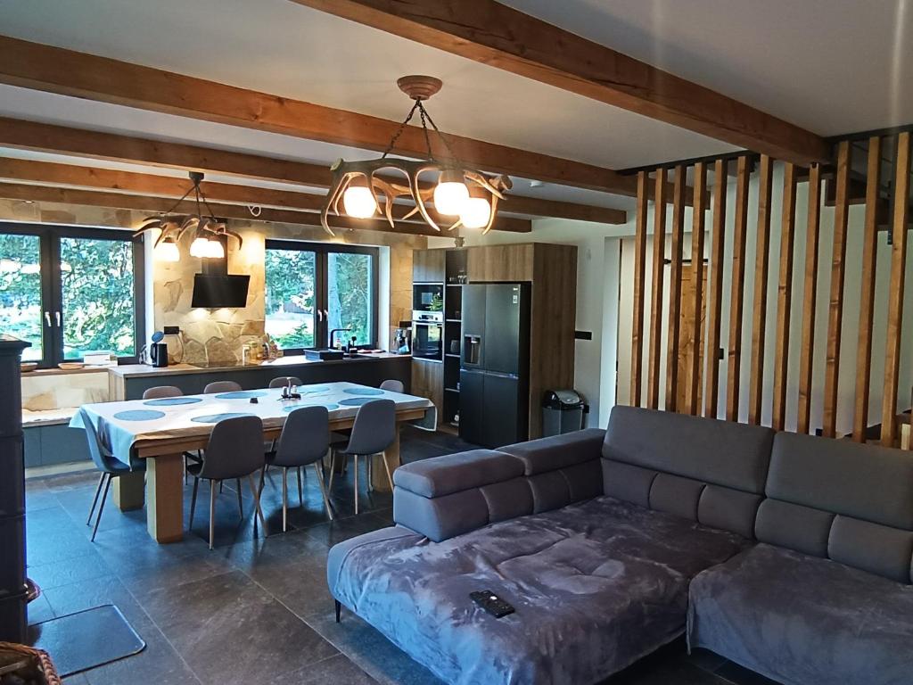 a living room with a couch and a table at Chalet Martinky in Martin