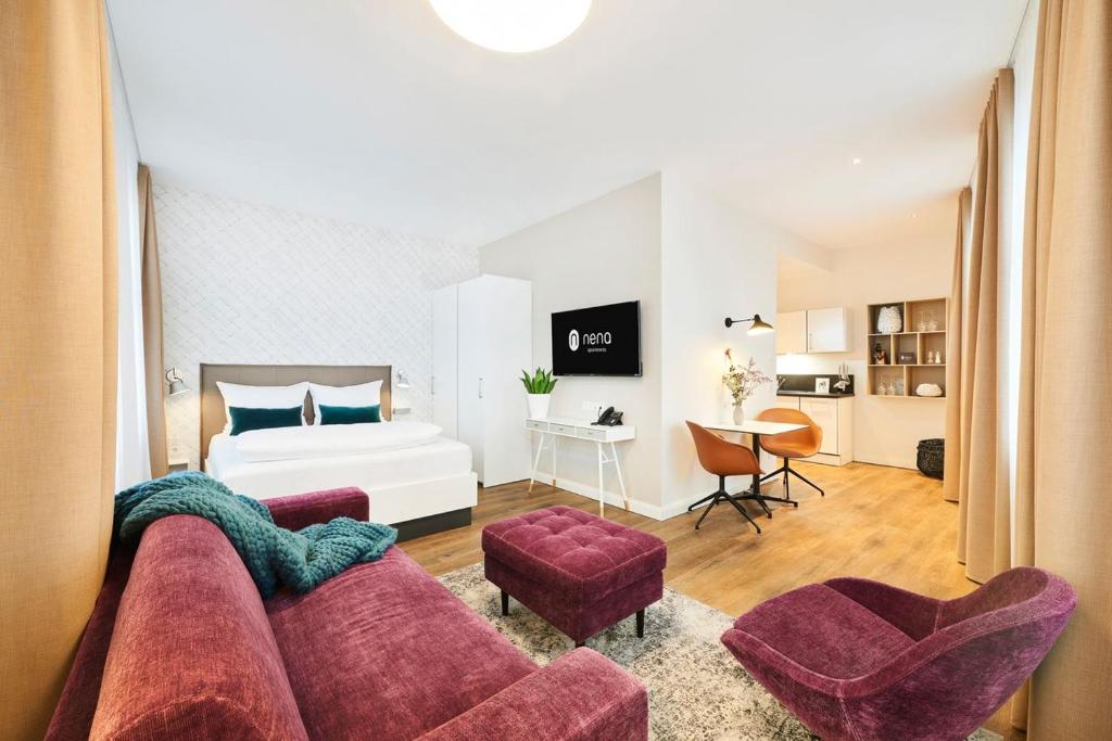 a living room with a couch and a bed at ATTICK CASTLE 6 Person 4ZKB 100sqm with Balcony and VIEW in Minden