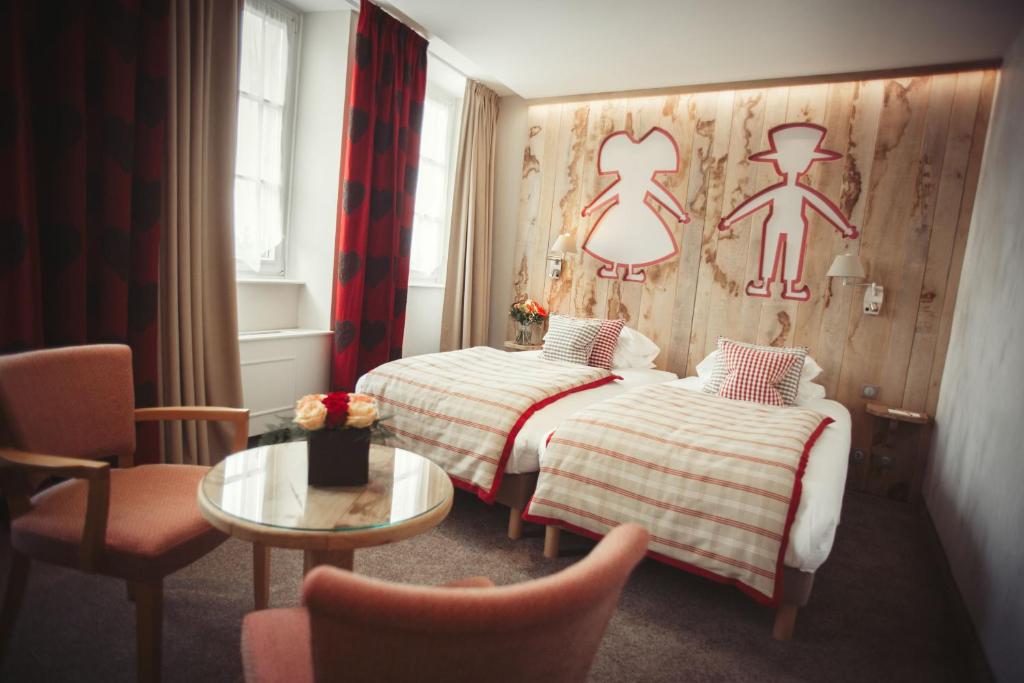 Postel nebo postele na pokoji v ubytování Hotel Beaucour