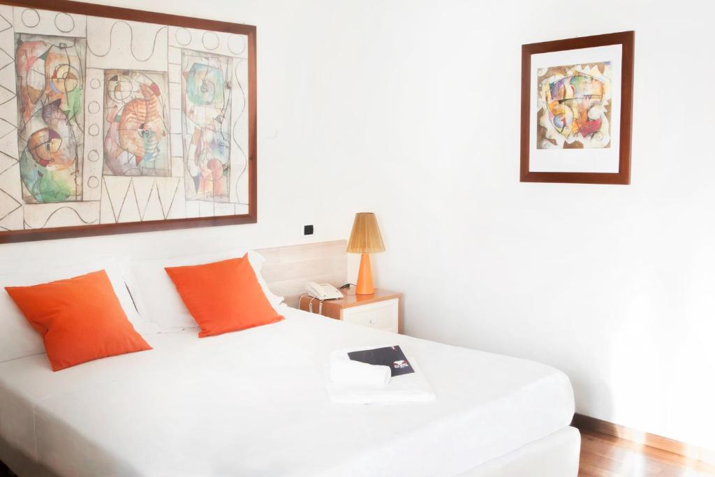 Posteľ alebo postele v izbe v ubytovaní Blu Hotel