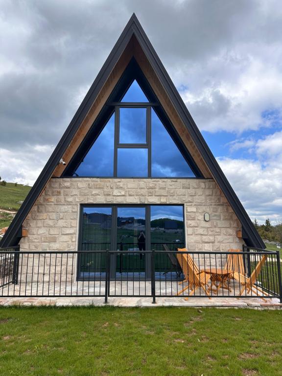 a large window on the front of a house at Durmitor Panorama in Žabljak