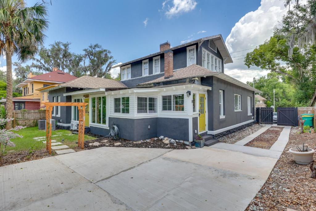 a house with a driveway in front of it at 2-Unit Bundle in Eustis: Walk to Ferran Park! in Eustis