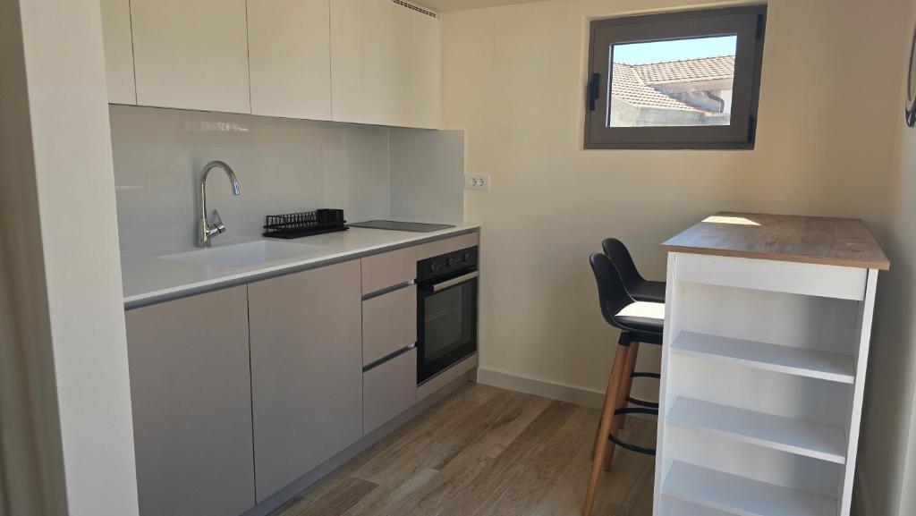 a small kitchen with a sink and a counter at 2 4 D2 Mini Condos Studio Loft West facing in Tivat