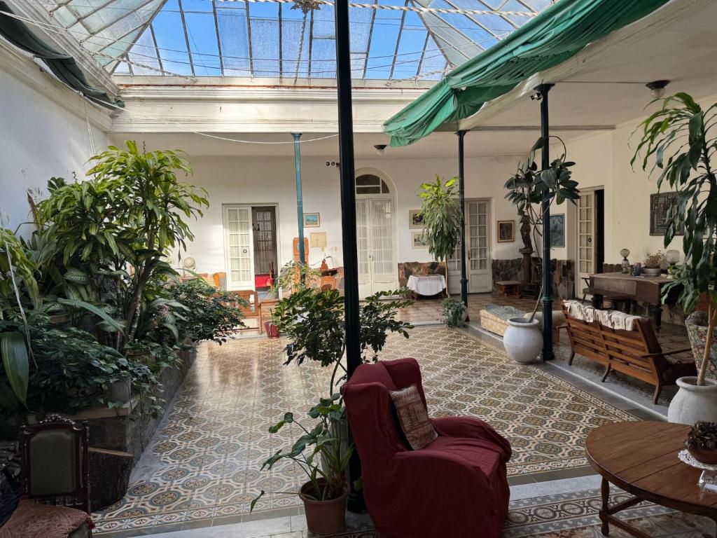a room filled with lots of potted plants at Casa Grande in Mercedes