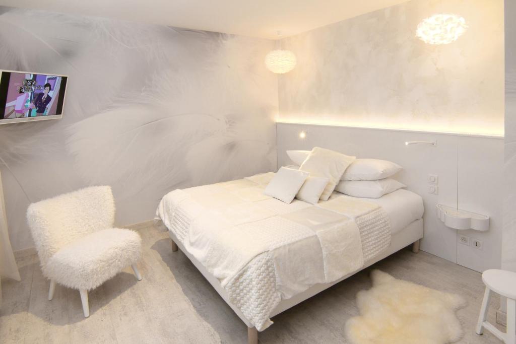 Postel nebo postele na pokoji v ubytování Hotel Beaucour