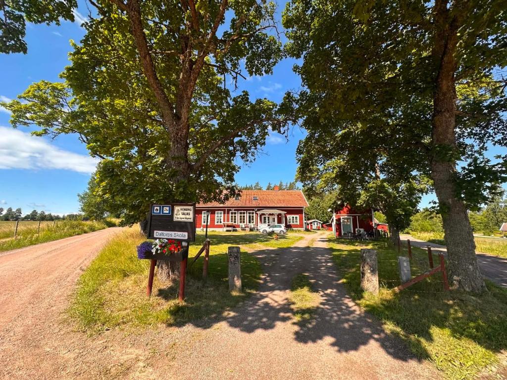 a red house on the side of a road at Daltorps skola - self check in in Skövde