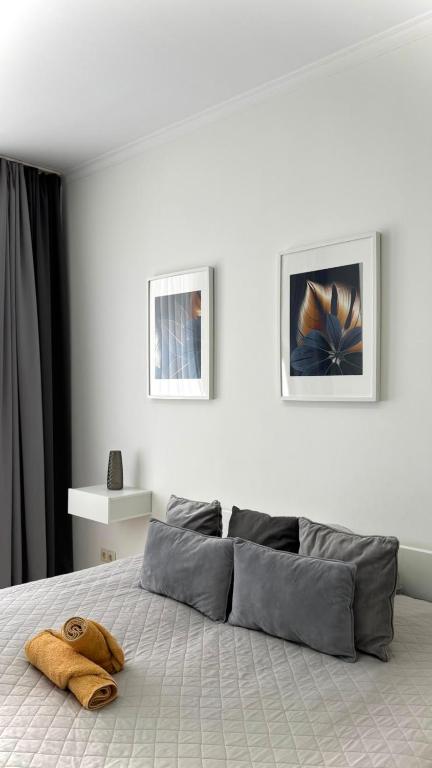 a bedroom with a bed with a pillow on it at HOME City Stay Chemnitz in Chemnitz