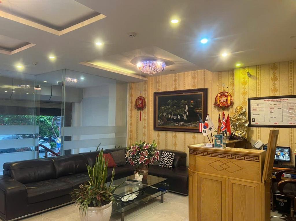 a living room with a couch and a table at Dragon Hotel Ha Noi in Hanoi