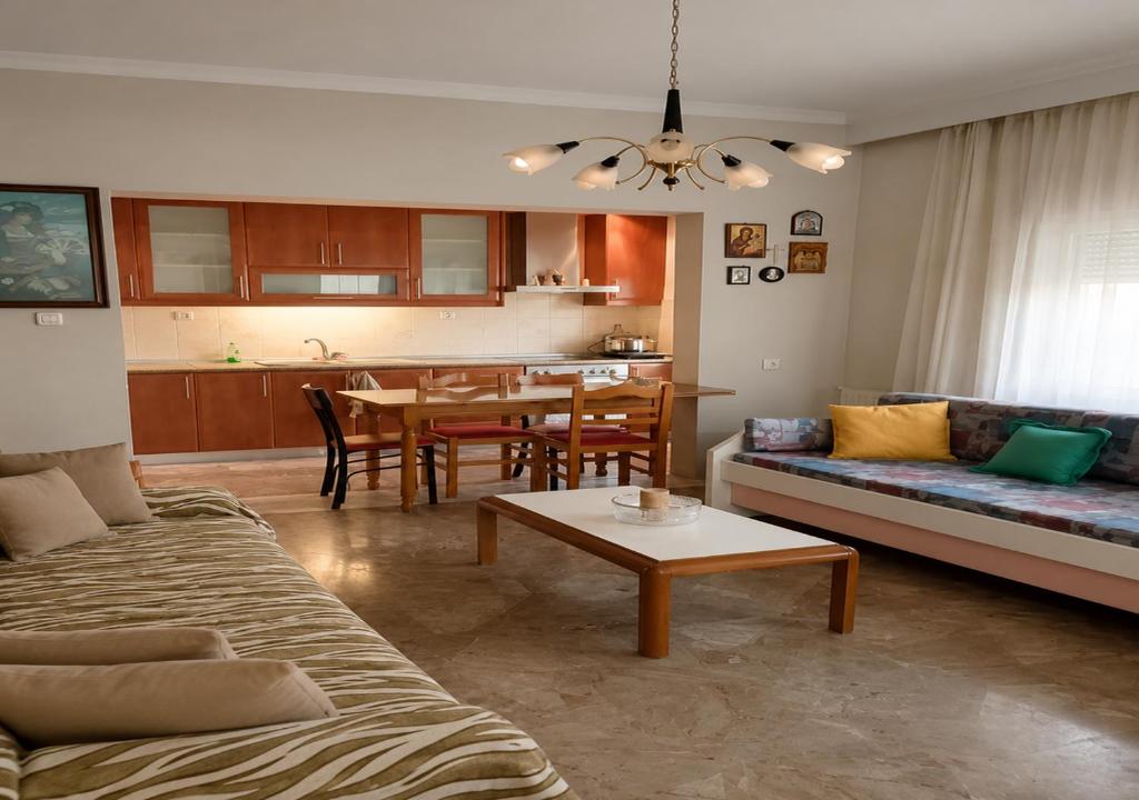 a living room with a couch and a table at Kolhida home in Kilkis