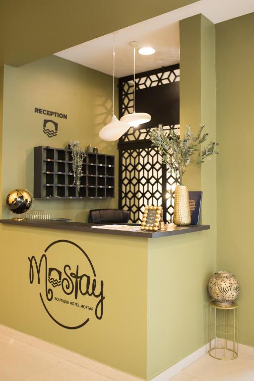 a kitchen with a macstay sign on the wall at Mostay Boutique Hotel in Mostar