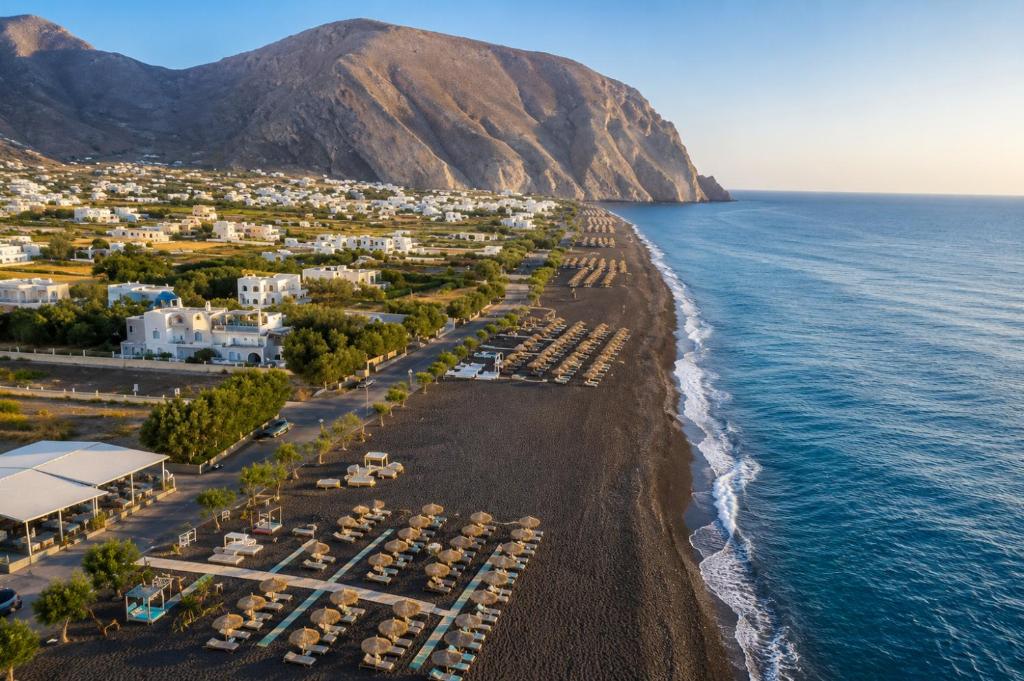 an aerial view of a beach and the ocean at Nest & Rest Perissa in Perissa