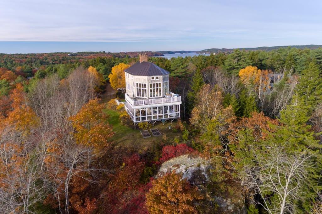 an aerial view of a house in the woods at Bayfront home with 270-degree views, large deck & porch - near Popham Beach in Phippsburg
