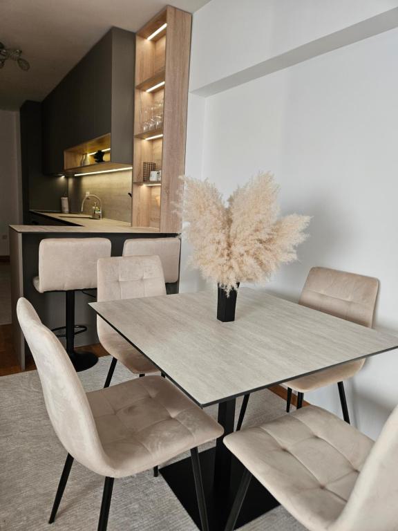 a dining room with a table and chairs at La Casa in Livno