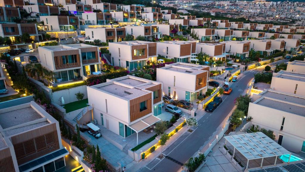 an aerial view of a city at night at Kalpazo White Stones in Palasë