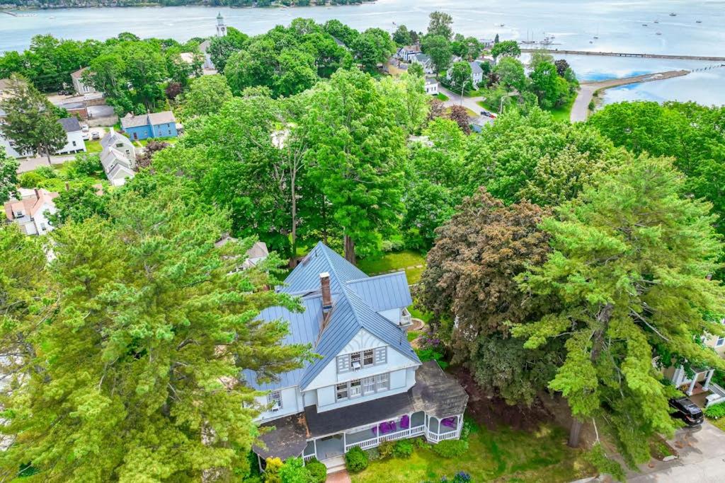 an overhead view of a house with a blue roof at Beautiful home with Ping-Pong, fast WiFi & W/D - walk to dining in Wiscasset