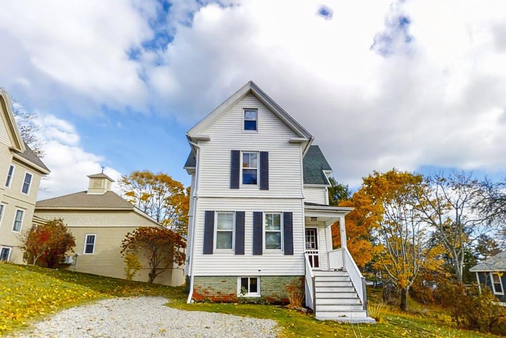 a white house and a white house at Newly Renovated Haven w/ Deck, Walk to Shops, Dining & Marina, Pet friendly in Boothbay Harbor